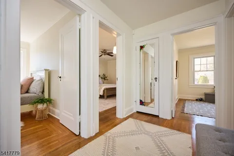 a bathroom with a sink mirror and vanity