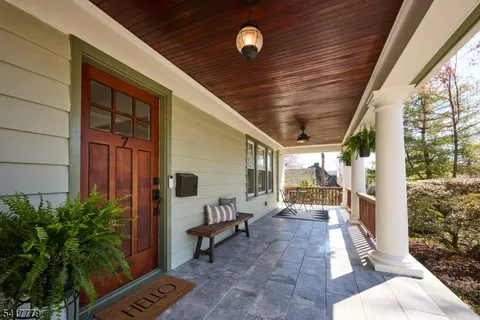 a living room with furniture a fireplace and a table