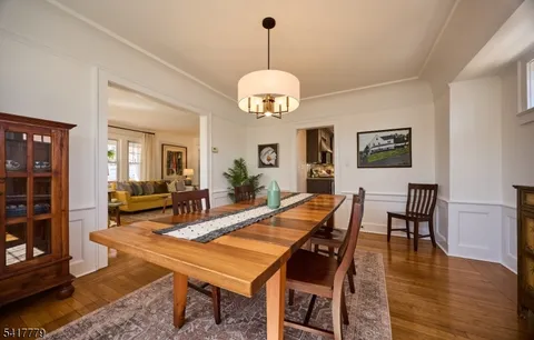 a kitchen with granite countertop wooden cabinets and stainless steel appliances