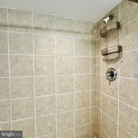 a bathroom with a toilet a sink and a mirror