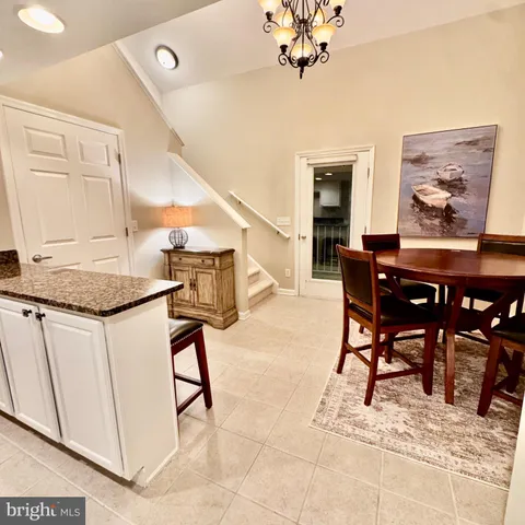 a view of dining room and kitchen island with furniture