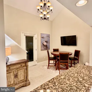 a view of a livingroom with furniture and a chandelier