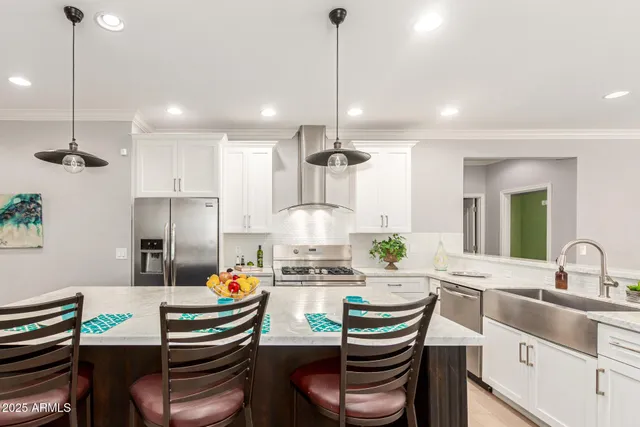 a kitchen with granite countertop kitchen island cabinets and stainless steel appliances