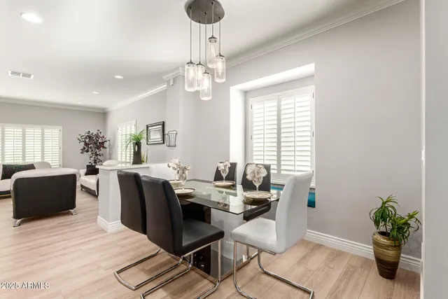 a view of a dining room with furniture window and wooden floor