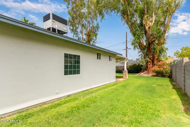 a backyard of a house with lots of green space
