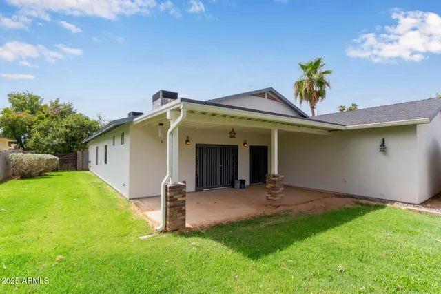 a view of a backyard with a garden and plants