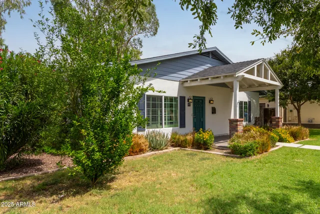 a front view of a house with garden