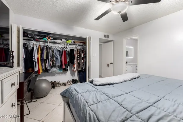 a bedroom with a bed and walk in closet