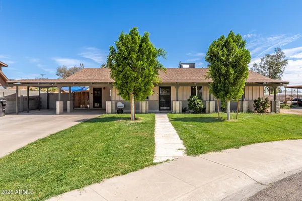 front view of a house with a yard
