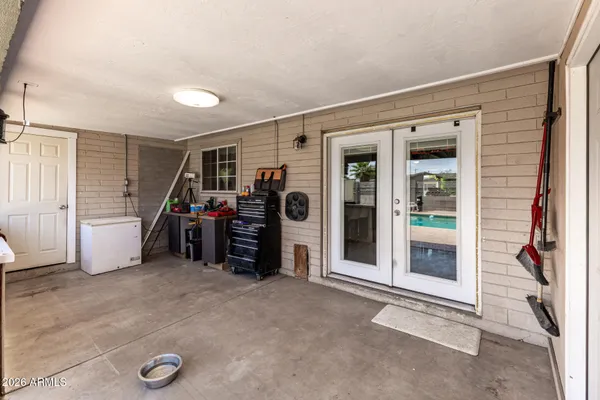 a view of a livingroom with furniture and a window