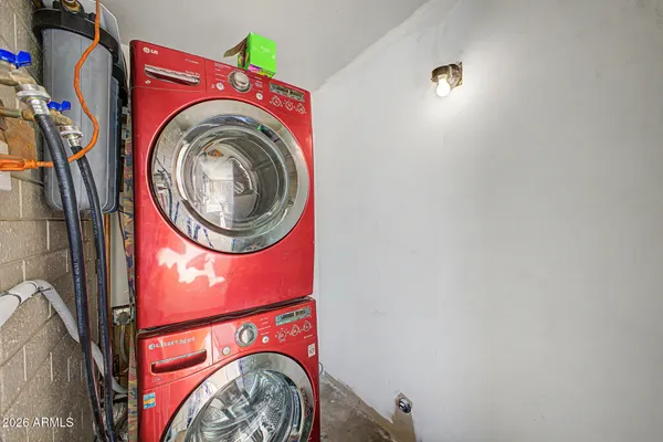 an empty room with wooden floor and cabinet