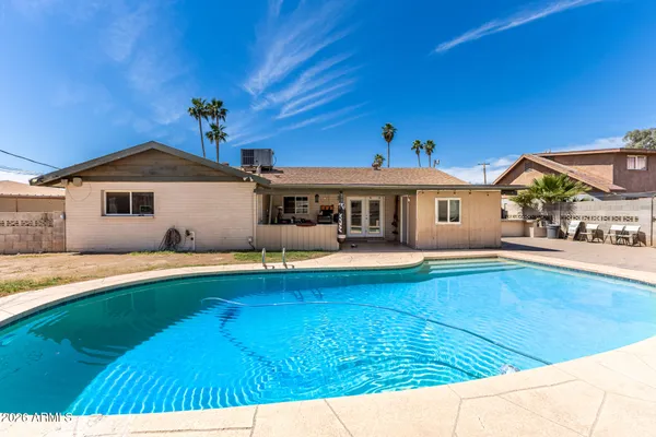 a front view of a house with swimming pool