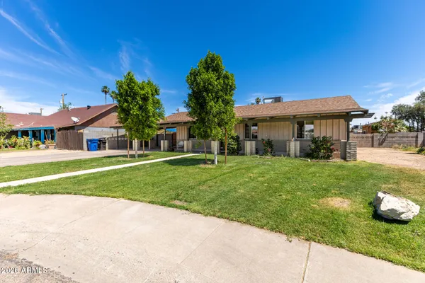 front view of a house with a yard