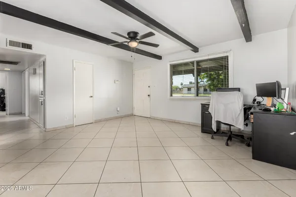 a view of a livingroom with furniture and a window