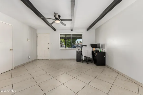 a view of workspace with furniture and window