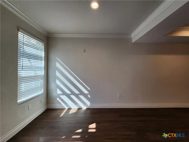 a view of an empty room and window