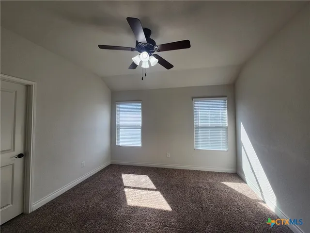 a view of empty room with windows