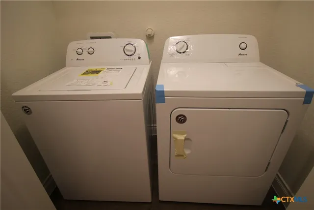 a utility room with dryer and washer