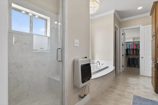 a bathroom with a tub shower and a sink