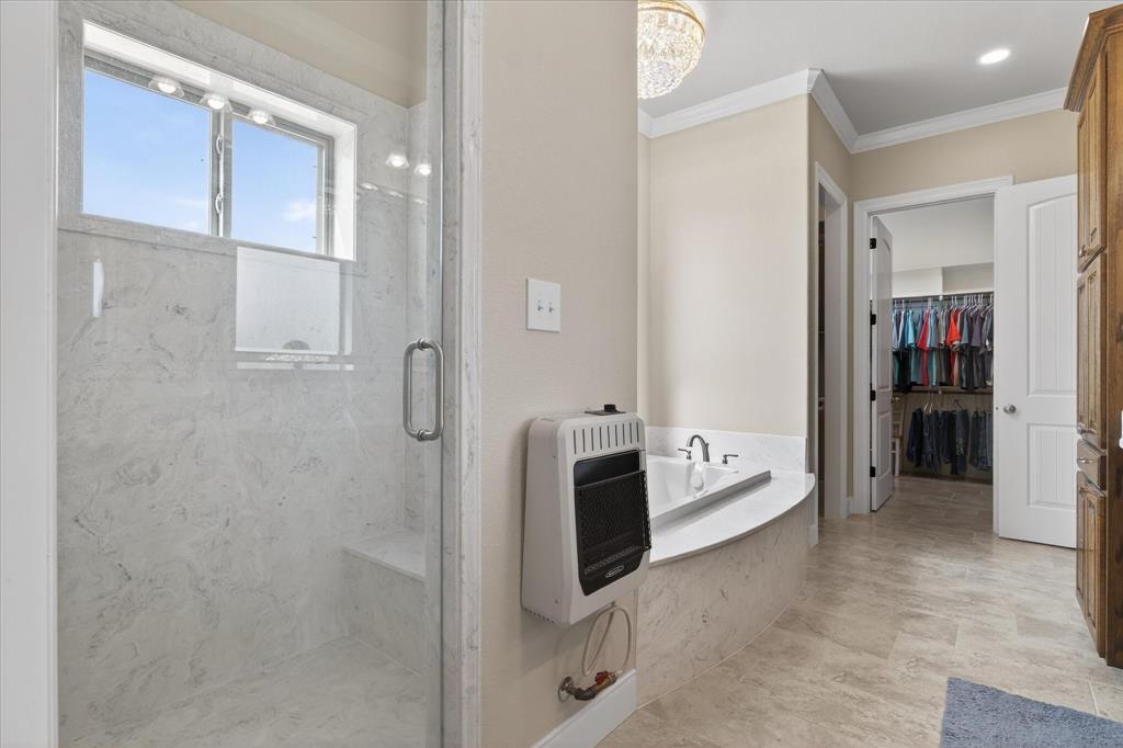 790 Bones Chapel Road Whitesboro, TX 76273 - Photo 20 of 40 a bathroom with a tub shower and a sink