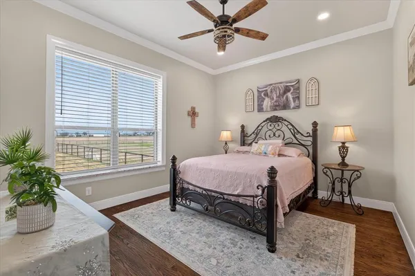 a bedroom with a bed and a potted plant