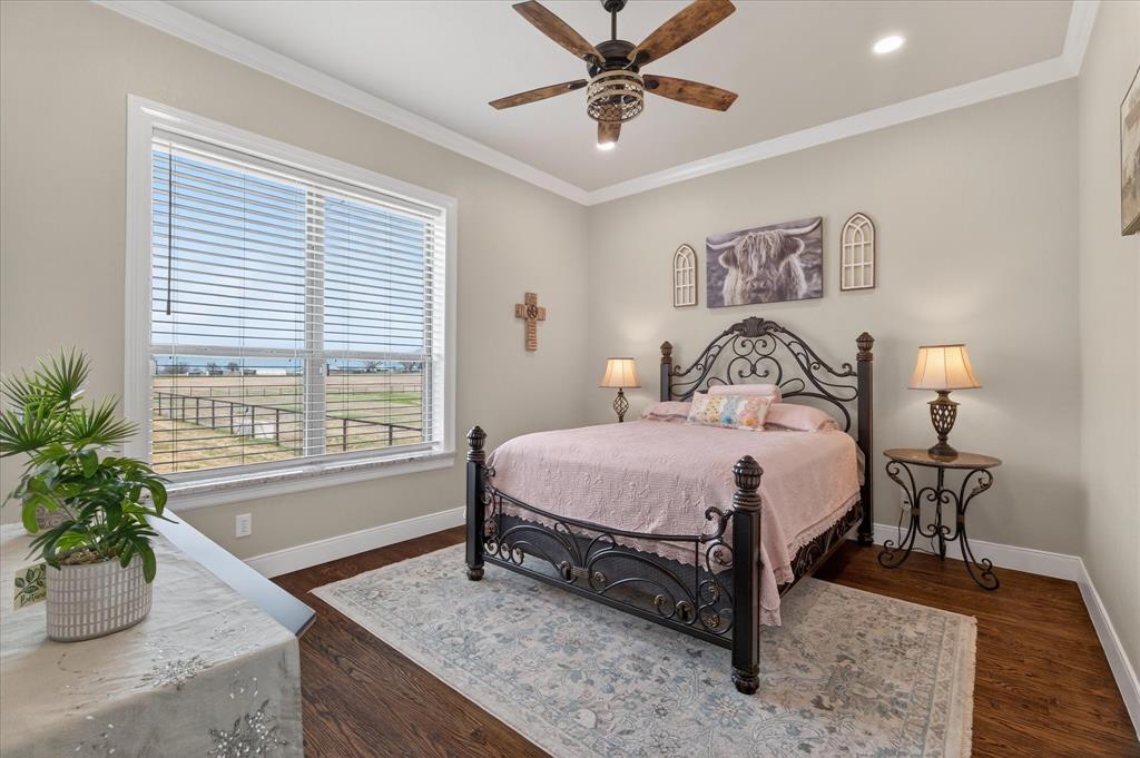 790 Bones Chapel Road Whitesboro, TX 76273 - Photo 23 of 40 a bedroom with a bed and a potted plant