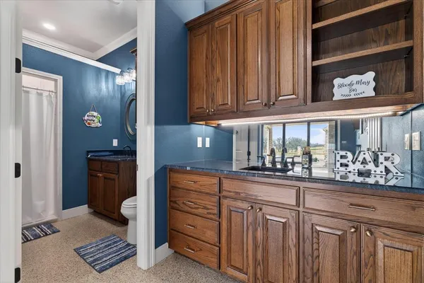 a kitchen with stainless steel appliances granite countertop a sink and cabinets