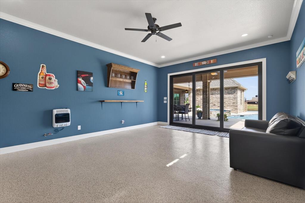 790 Bones Chapel Road Whitesboro, TX 76273 - Photo 25 of 40 a living room with furniture and a large window