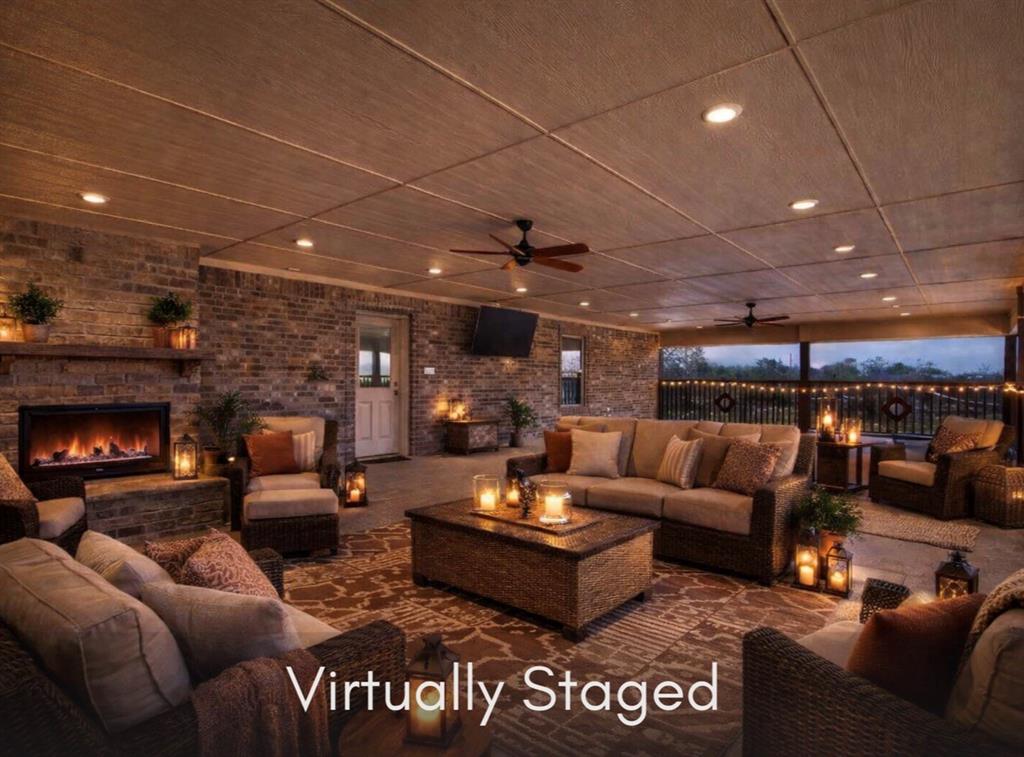 790 Bones Chapel Road Whitesboro, TX 76273 - Photo 39 of 40 a living room with furniture and a fireplace