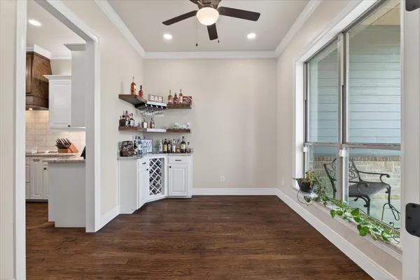 a kitchen with stainless steel appliances a refrigerator and a stove top oven