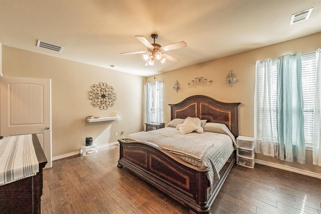 5112 Leeray Road Fort Worth, TX 76244 - Photo 16 of 34 a bedroom with a bed and a window