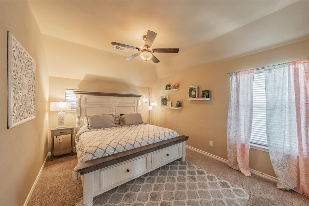 5112 Leeray Road Fort Worth, TX 76244 - Photo 21 of 34 a bedroom with a bed and a window