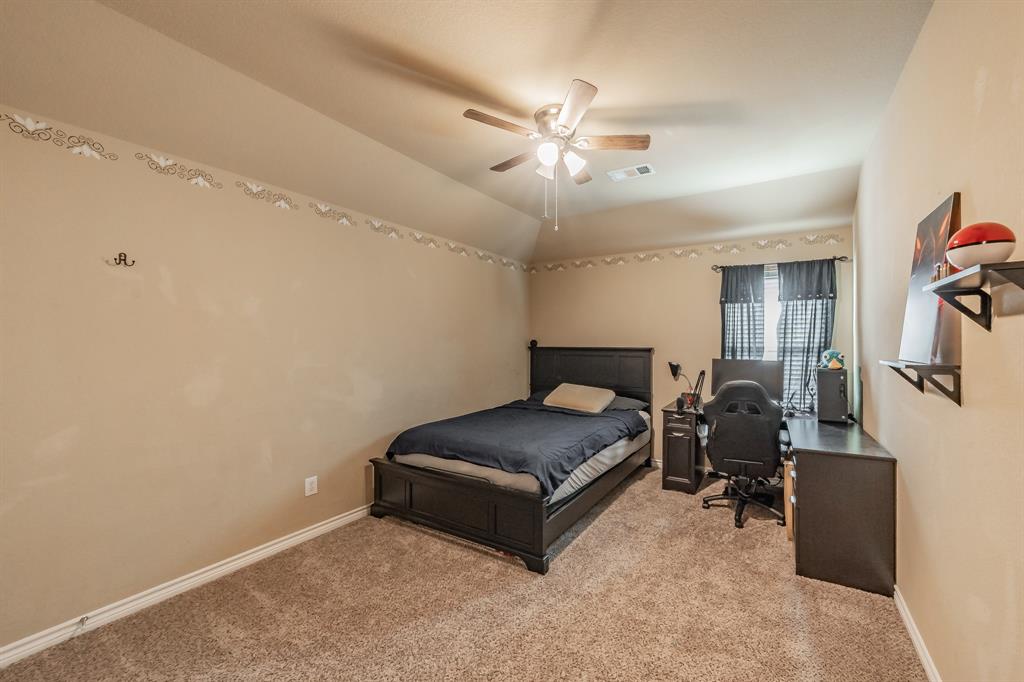 5112 Leeray Road Fort Worth, TX 76244 - Photo 26 of 34 a living room with furniture and a chandelier