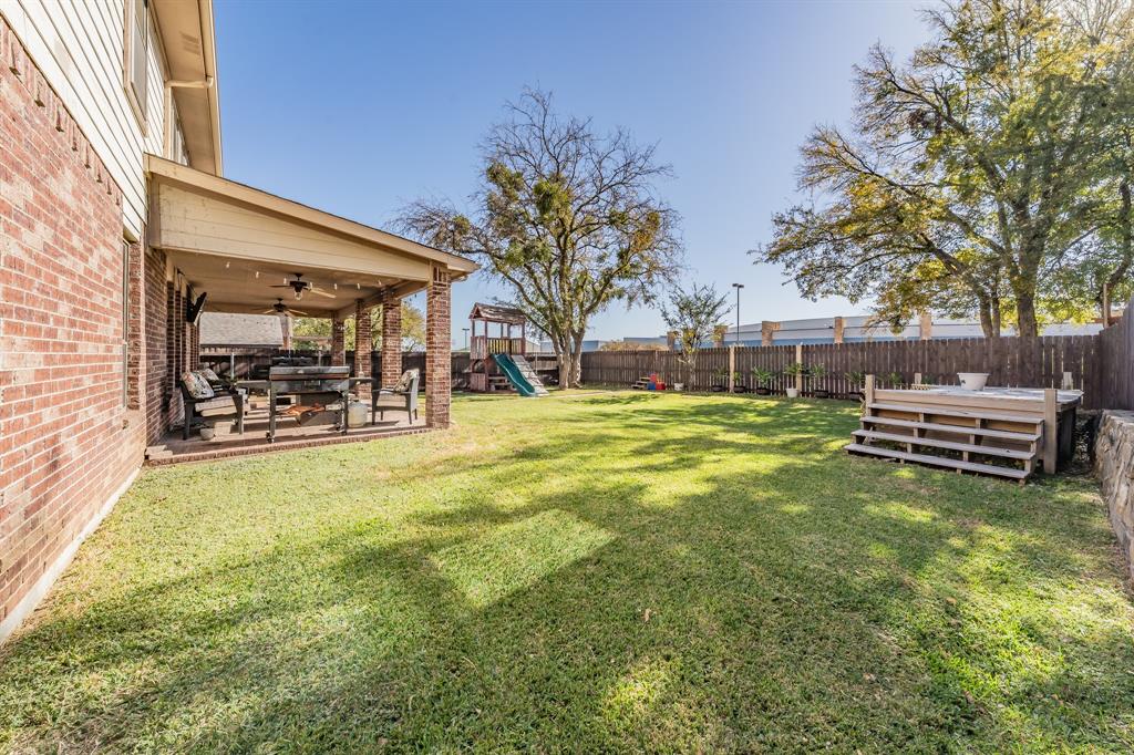5112 Leeray Road Fort Worth, TX 76244 - Photo 30 of 34 a view of swimming pool with lawn chairs and wooden fence