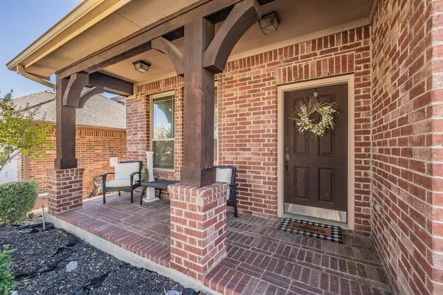 a view of a porch with chairs and floor