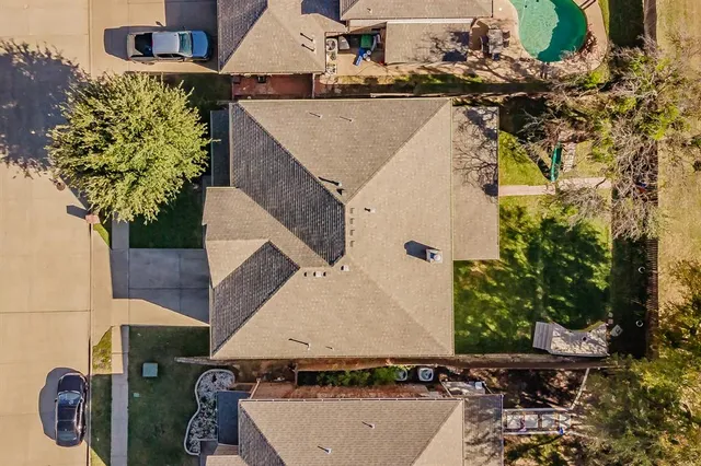 an aerial view of a house with swimming pool