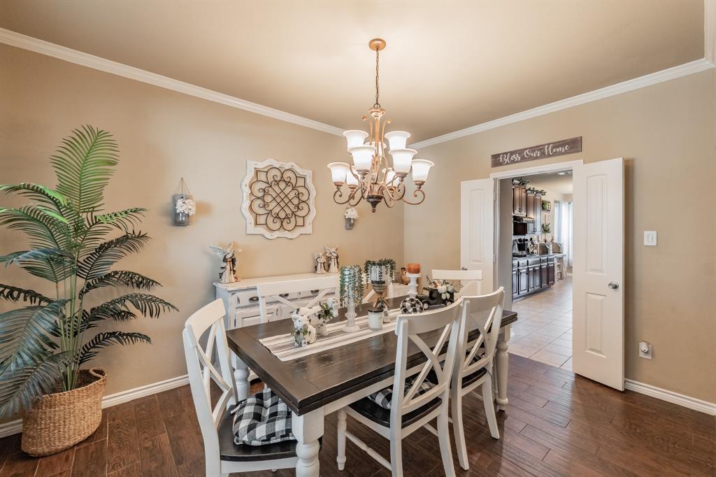 5112 Leeray Road Fort Worth, TX 76244 - Photo 5 of 34 a view of a dining room with furniture and wooden floor