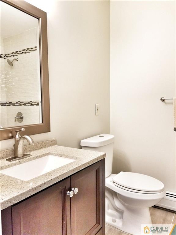 116 Emerson Road Somerset, NJ 08873 - Photo 11 of 22 a bathroom with a granite countertop sink mirror vanity and toilet