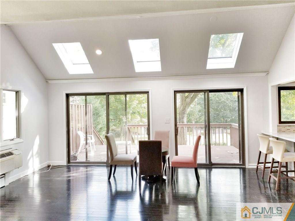116 Emerson Road Somerset, NJ 08873 - Photo 3 of 22 a view of a dining room with furniture window and wooden floor