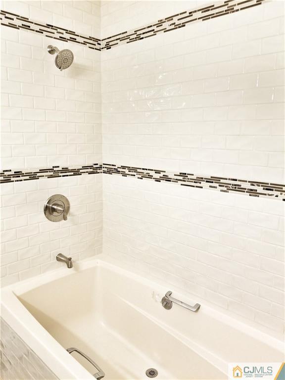 116 Emerson Road Somerset, NJ 08873 - Photo 6 of 22 a bathroom with a shower and a bath tub