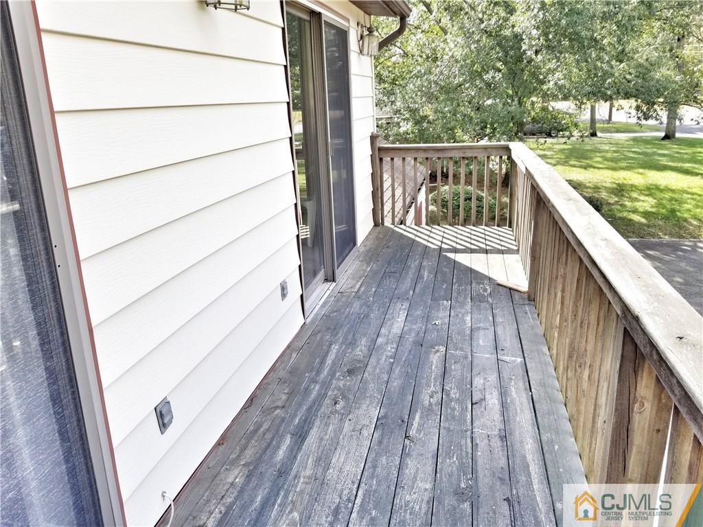 116 Emerson Road Somerset, NJ 08873 - Photo 9 of 22 a balcony with wooden floor