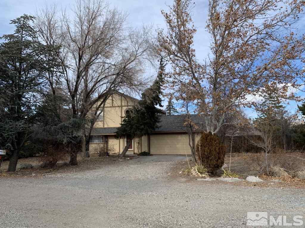 100 Silverstone Place Reno, NV 89512 - Photo 1 of 17 a view of house with a snow in the yard