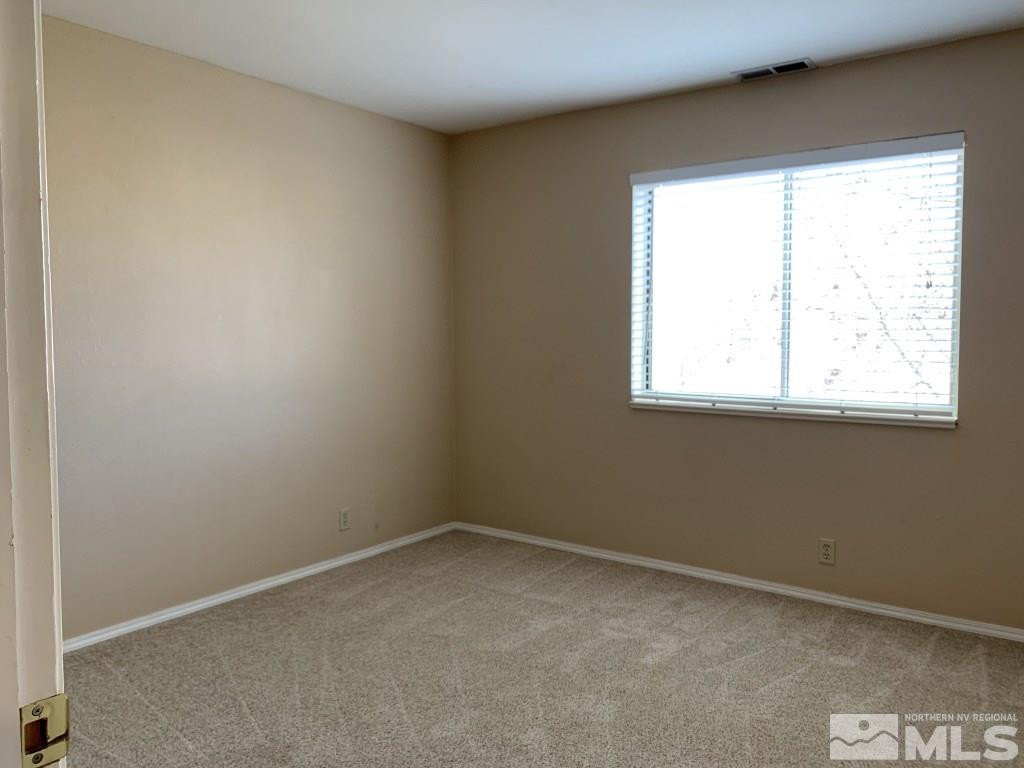 100 Silverstone Place Reno, NV 89512 - Photo 13 of 17 an empty room with a window