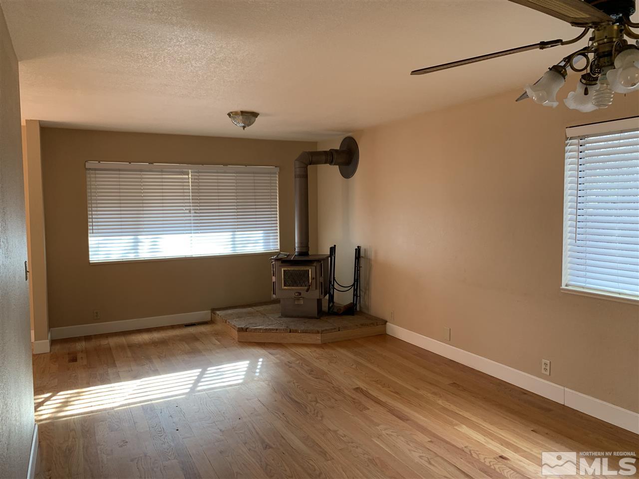 100 Silverstone Place Reno, NV 89512 - Photo 3 of 17 a view of a room with wooden floor and windows