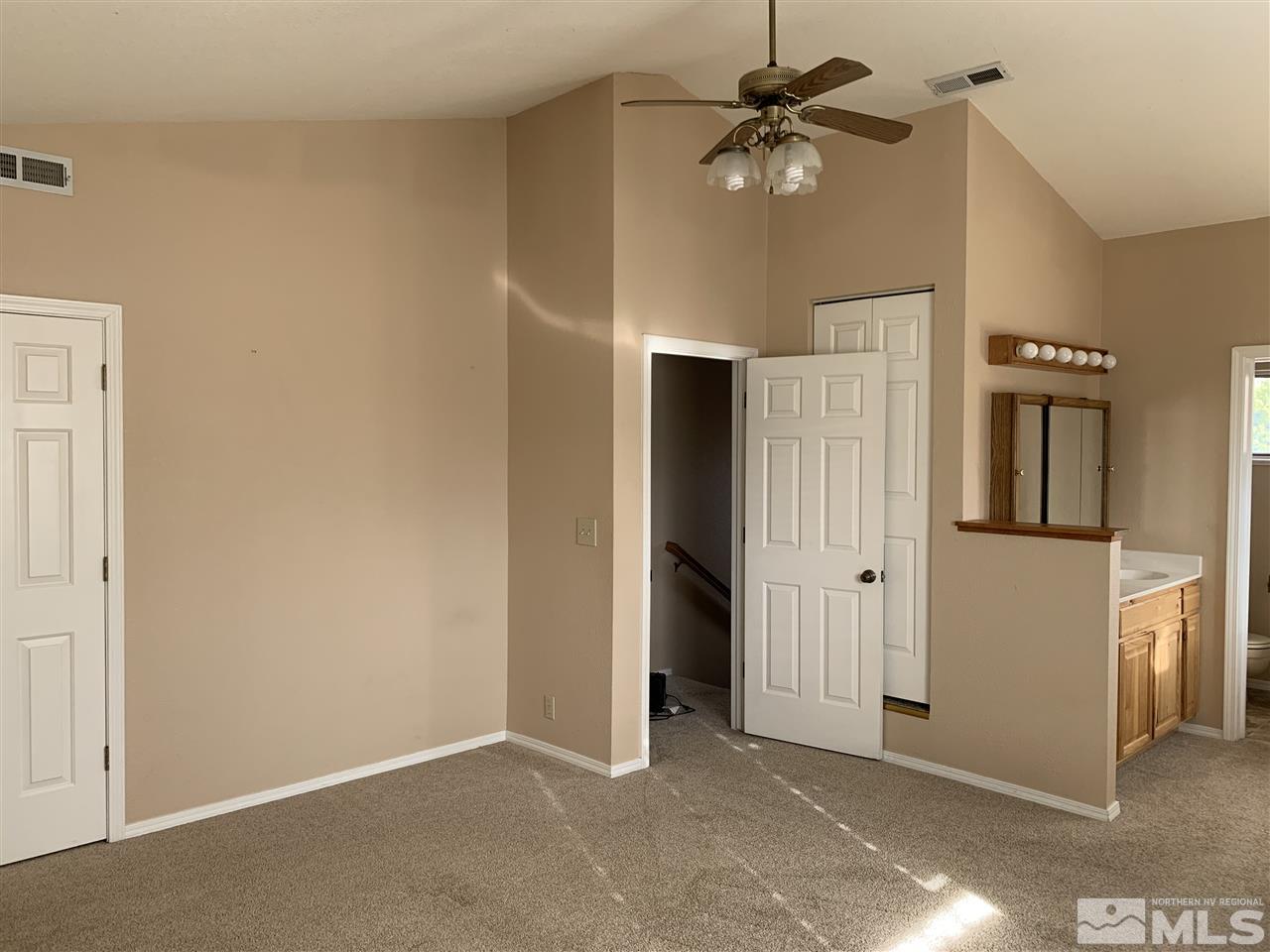 100 Silverstone Place Reno, NV 89512 - Photo 8 of 17 a view of a livingroom with a ceiling fan and a fan