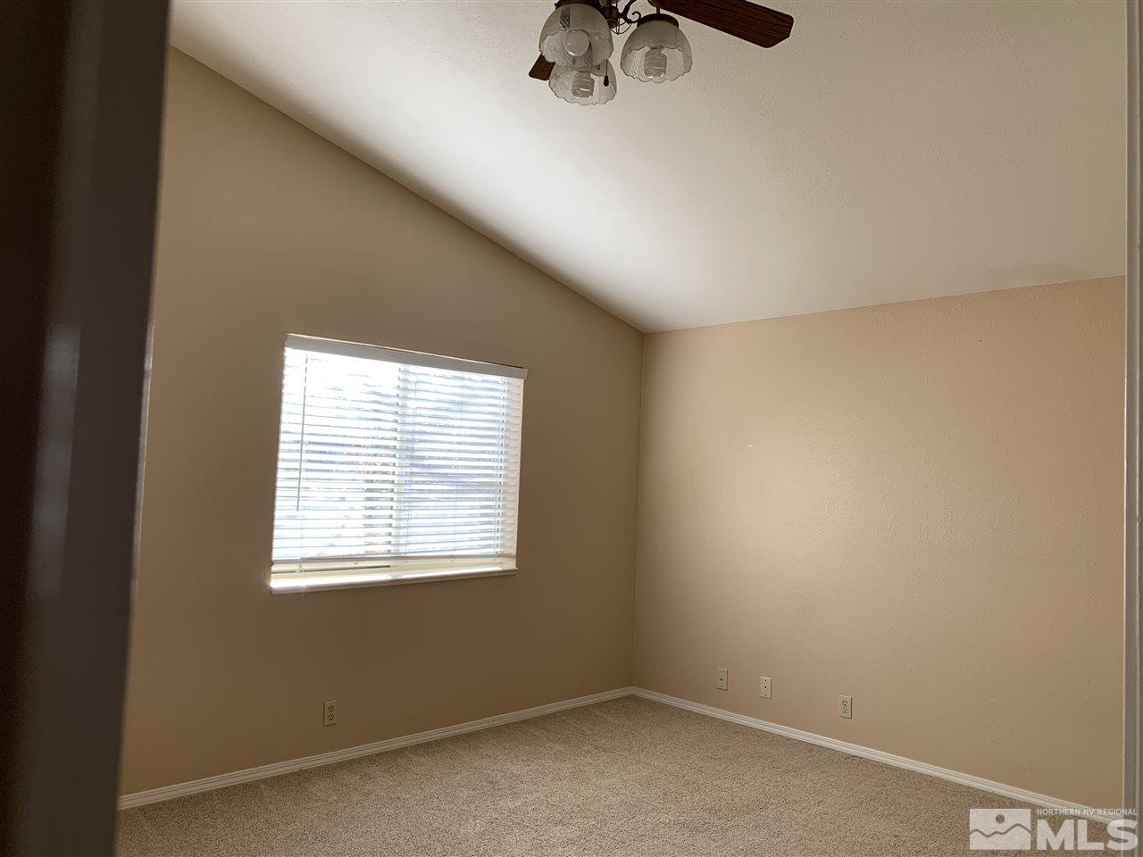 100 Silverstone Place Reno, NV 89512 - Photo 9 of 17 an empty room with a window