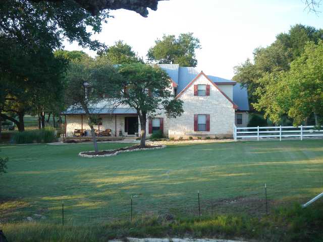 33 Long Creek Road Austin, TX 78737 - Photo 1 of 1 a front view of a house with a yard