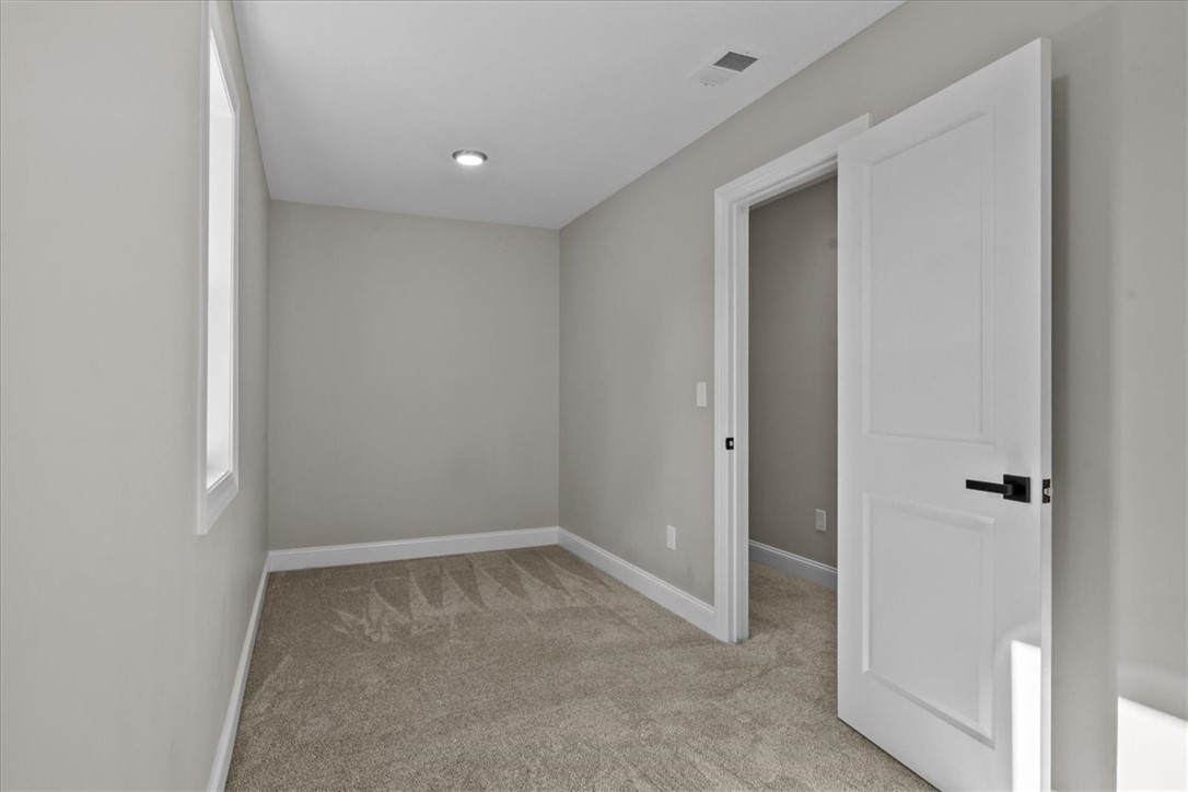 105 Bree Drive Anderson, SC 29621 - Photo 27 of 48 A well-lit room awaits, featuring plush carpeting and a bright window.