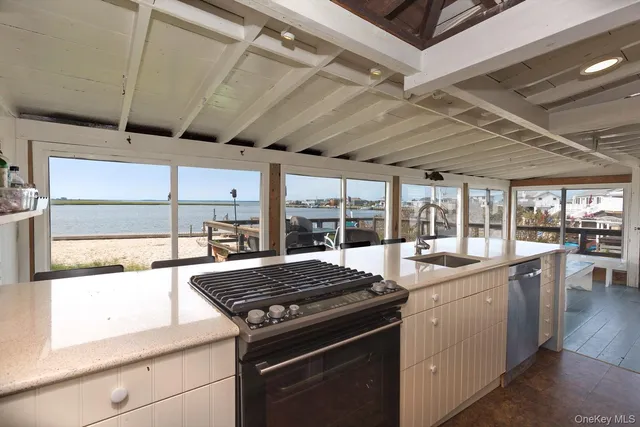 a kitchen with a stove and a sink