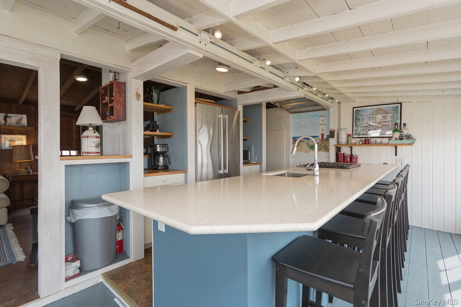 39 Point Road Westhampton Beach, NY 11978 - Photo 5 of 15 a view of kitchen island with stainless steel appliances refrigerator stove and microwave